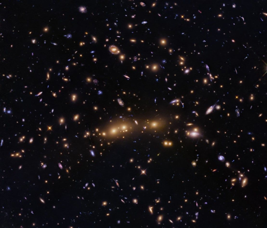 Hubble Glimpses Merging Galaxy Clusters